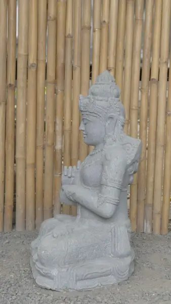 Product image 6 of the product “Seated Dewi Sri, position chakra turning the wheel, 79,5 cm high riverstone grey, modell with sativa ”